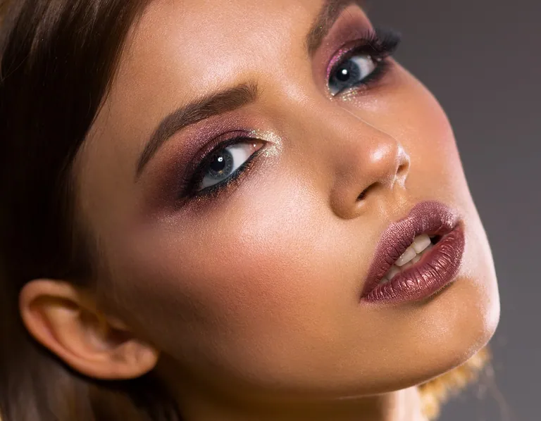 Creative eye and lip makeup in a beauty portrait